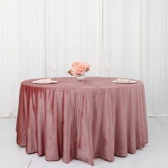 a round table with pink flowers on it