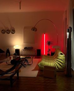 a living room filled with furniture and a red light