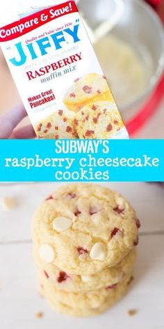 a person holding up a box of jelly raspberry cheesecake cookies next to a stack of cookies