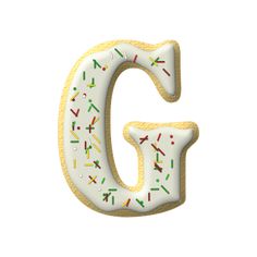 the letter g is decorated with sprinkles and frosting on it's sides