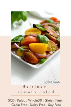 a white plate topped with vegetables on top of a table