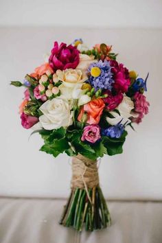 a bouquet of flowers sitting on top of a table