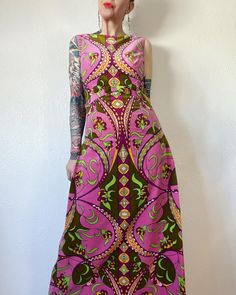 Sweet Psych. Stunning Vintage 1960's pink psychedelic printed cotton velvet maxi dress with princess seam bust, looped button side torso, inverted pleats and attached bow waist belt, made in Italy. Not Pucci, but dang she carries that vibe v-well. And look at that print & palette. She's been a labor of restoration love over the last month or so & I'm proud of how she turned out and happy to finally offer her up to you.  💚 Marked a vintage size 12 Fits M/possibly smaller L (I'm about a M), but please use measurements as fit guide.  15" shoulders  19" bust (on the half)  16" waist (on the half)  20" hip above inverted side pleats (on the half)  Up to 23" hip low hip with inverted pleats (on the half)  55" length  *if hips are larger than 20", this would be a slip over the head piece, where Pink Printed A-line Maxi Dress, Retro Pink A-line Dress, Pink Sleeveless Dress With Retro Print, Pink Fitted A-line Maxi Dress, Fitted Pink A-line Maxi Dress, Vintage Pink A-line Dress, Retro A-line Maxi Dress, Vintage Pink Printed Dresses, Vintage Printed Party Dresses