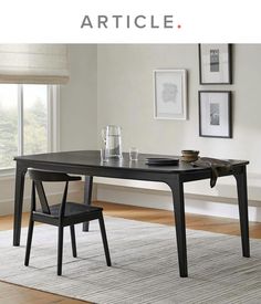 a black table with two chairs in front of it and the words article above it