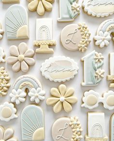 many decorated cookies are displayed on a white surface