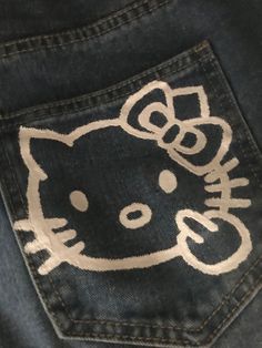 a hello kitty patch on the back of a pair of jeans