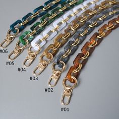 a number of different colored chains on a table