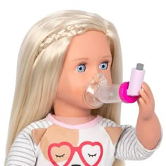 a doll with blonde hair and glasses is holding a bottle in her hand while wearing a sweater