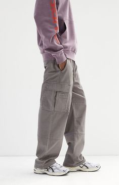 The Stretch Gray Baggy Cargo Pants from PacSun feature a drawstring waistline and a relaxed, baggy fit from the thigh through the knee, ending in a wide leg opening. Made from a cotton blend, these pants offer multiple pockets for added storage and convenience, including side entry pockets.Drawstring waistlineSide pocketsRelaxed fitCargo pocketsWide leg openingWelt back pockets30" Inseam19.5" Leg openingMeasurements taken from a size medium98% Cotton, 2% spandexMachine washableModel is wearing size mediumModel Measurements: 6'2â Height, 30â Waist, 32â Inseam PacSun Mens Stretch Gray Baggy Cargo Pants size Small Baggy Gray Cargo Pants With Pockets, Baggy Gray Cargo Pants, Gray Parachute Pants With Side Pockets For Streetwear, Gray Cargo Pocket Jeans For Streetwear, Cargo Pants Grey, Relaxed Fit Gray Full-length Cargo Pants, Grey Pants Men, Grey Cargo Pants, Pacsun Mens