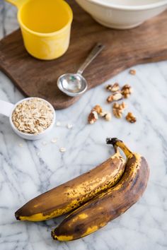 bananas, oatmeal and orange juice on a marble table