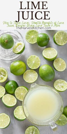 lime juice in a glass surrounded by limes