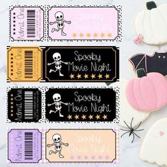 halloween movie night printables with cookies and candy bar wrappers on a table