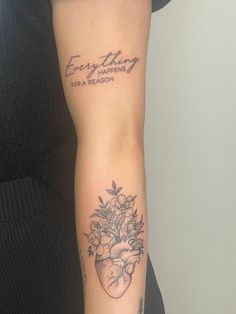 a woman with a tattoo on her arm that says everything happens for a reason and flowers