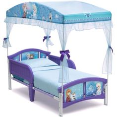 a child's bed with a canopy over it