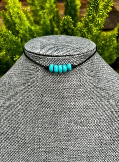 5 stone 5x8mm howlite turquoise stones.  Premium leather is very soft and comfortable. It is 1.5mm thick. Shiny black.  End caps and lobster clasps are all stainless steel and will not tarnish or peel.  Will be shipped in a pretty organza bag.  Please message me if you don't see the size you need.   Thank you Minimalist Adjustable Turquoise Necklace, Handmade Adjustable Turquoise Choker Necklace, Minimalist Adjustable Blue Turquoise Necklace, Handmade Adjustable Black Turquoise Necklace, Adjustable Turquoise Choker Necklace, Adjustable Beaded Turquoise Choker, Handmade Adjustable Turquoise Choker, Handmade Blue Turquoise Choker Necklace, Hand-strung Turquoise Western Necklace