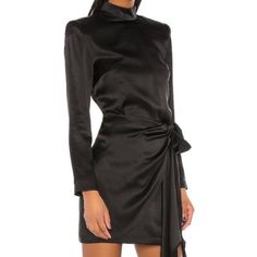 This Size Small Amanda Uprichard Dress Is The Perfect Little Black Dress For Formals, Cocktails, Or Weddings! High Band Neck With A Fully Open Back And A Faux Wrap Skirt. Special Details Include A Long Full Tie At The Waist And Slightly Padded Shoulders. 100% Silk Black Silk Fully Lined In 100% Poly. Hidden Back Zip Closure With Fabric Button Fastenings At Collar. Padded Shoulders. Waist Tie Detail. Dry Clean Only. Excellent Used Condition With No Visible Flaws. Amanda Uprichard Dress, Faux Wrap Skirt, Perfect Little Black Dress, Amanda Uprichard, Black Silk, Wrap Skirt, Waist Tie, Open Back, Little Black Dress