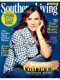 a woman sitting on top of a magazine cover with her hand under her chin and looking at the camera