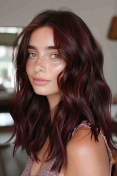 Woman with wavy auburn hair and freckles, wearing a pink top, looking at the camera. Balayage Brown To Red, Makeup For Burgundy Hair, Dark Red Hair Makeup, Cherry Brown Hair With Highlights, Cherry Brown Highlights, Red Undertone Hair, Balayage Burgundy, Burgundy Balayage Hair, Red Brunette Hair