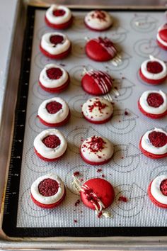 red velvet macarons are arranged on a baking sheet