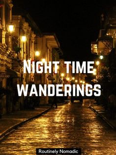 the words night time wanderings are lit up on an empty street