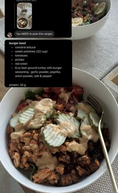 a bowl filled with meat and vegetables covered in sauce next to a fork on top of a table