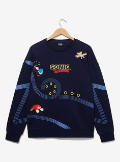 You've gotta go fast when you're wearing this Sonic the Hedgehog sweatshirt! Featuring portraits of Sonic  Tails  and Knuckles with racing lines tracing Sonic's path and gold rings  this crewneck is perfect for fans of the video game series.A BoxLunch Exclusive!52% cotton; 48% polyesterListed in unisex sizesWash cold with like colors; dry lowImported Sonic Outfits Ideas, Vintage Sonic Shirt, Sonic The Hedgehog Clothes, Sonic Blanket, Sonic Clothes, Sonic Y2k, Sonic Rings, Sonic Merch, Sonic Tails And Knuckles