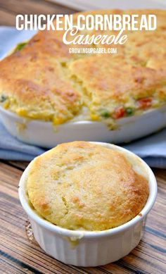 chicken cornbread casserole in a white dish on a wooden table with a blue napkin