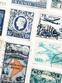 many different postage stamps are displayed together