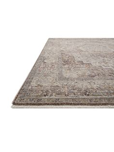 a large rug with an intricate design on the top and bottom, in beige tones