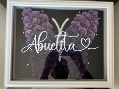 a butterfly made out of paper with the word abueetta written on it