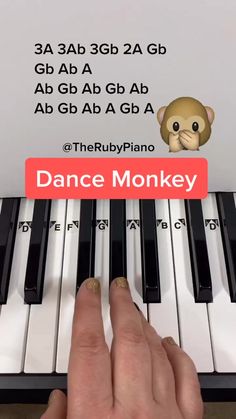 someone is playing the piano with their finger on it's keyboard and there is an ad for dance monkey