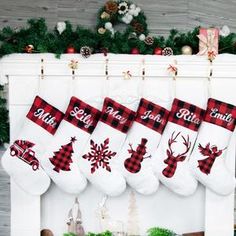 christmas stockings hanging from a fireplace with red and white plaid designs