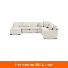 a white sectional couch with pillows on it and the words $ 350 & under below