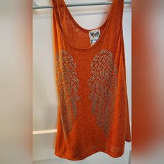 Vocal Flowy Burnout Tank W Stud Angel Wings Details. Size Small. Nwot Orange Tank Top For Summer Beach Days, Trendy Orange Cotton Tank Top, Orange Tank Top For Beach And Summer, Orange Summer Beach Tank Top, Orange Tank Top For Beach In Summer, Casual Orange Tank Top For Beach, Casual Orange Tank Top For The Beach, Casual Orange Tank Top For Vacation, Casual Orange Tank Top For Spring