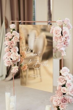 a table with candles, flowers and a sign that says point & bate on it