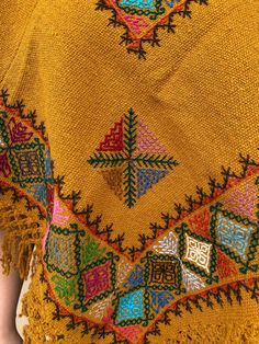 Beautiful poncho hand-woven in a backstrap loom and cross stitch hand-embroidered Color: Mustard, colorful embroidery Fits ONE SIZE Bohemian Handwoven Shawl Poncho, Handwoven Poncho Shawl For Festivals, Handwoven Festival Poncho Shawl, Bohemian Embroidered Kaftan For Fall, Bohemian Embroidered Multicolor Shawl, Bohemian Multicolor Embroidered Shawl, Bohemian Handwoven Poncho For Festival, Handmade Bohemian Shawl Poncho, Traditional Woven Shawl Poncho