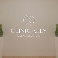 the logo for clinicly contoured is displayed on a wall