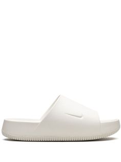 white signature Swoosh logo detail slip-on style round open toe memory foam insole rubber sole Nike Slides With Rubber Sole, Nike Open Toe Slides With Rubber Sole, Nike White Slide Sandals, Comfortable Nike Slip-on Slides, Comfortable Nike Slides With Rubber Sole, Comfortable White Foam Sandals, Nike Synthetic Slides With Rubber Sole, Casual White Foam Sandals, White Slides For Streetwear