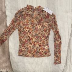 Floral Sheer Top With A Mock Neck Perfect For Fall New With Tags Beige Floral Print Tops For Fall, Brown Printed Tops For Spring, Fall Floral Print Beige Tops, Brown Floral Print Tops For Fall, Fall Sheer Sleeves V-neck Tops, Fall Sheer Stretch Lace Top, Fitted Beige Floral Print Top, Feminine Sheer Stretch Lace Top, Gold Crop Top