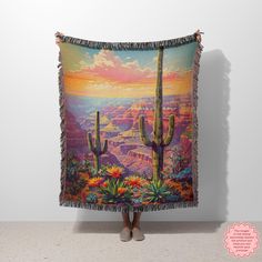 a woman standing in front of a wall with a tapestry hanging from it's side