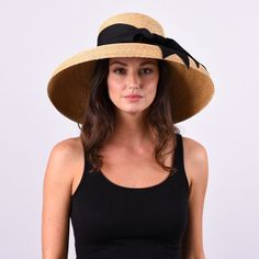 The Wauwinet hat is the epitome of New England elegance. Featuring a tall crown and a downturned brim, this dramatic hat is sure to turn heads. Material Our thin leghorn straw is hand-braided and then lock-stitched and blocked into shape. This is our stiffest straw. Trim Ships with our widest 3" black grosgrain ribbon with a hand-tied bow. We recommend a 3" ribbon due to the height of the crown on this shape. However, this hat can also work with a thinner, flat-tailored bow, or without any trim Tall Crown, Summer Traditions, Large Brim Hat, Wide Brim Straw Hat, Packable Hat, Sailor Shirt, Raffia Hat, Brim Hat, Shoes Booties