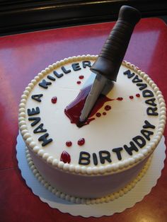 a birthday cake with a knife stuck in it