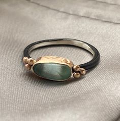 Beautiful piece of sea glass nested in a hand-crafted 14k gold fill bezel with a delicate oxidized sterling silver band with gold accents. My pieces are thoughtfully designed and one of a kind. You can be assured that no two pieces of sea glass are ever alike, making it even more special as it is passed on from generation to generation. I've listed a selection of sea glass they you may choose from. If you are interested in selecting a different piece from those shown or supplying me with that special find, please contact me. These rings arrive in a gift box, complete with a ribbon and a golden mermaid wax seal. RETURNS & EXCHANGES I gladly accept returns and exchanges Contact me within: 14 days of delivery Ship items back within: 30 days of delivery I don't accept cancellations But please Golden Mermaid, Mixed Metal Ring, Oxidized Ring, Mixed Metal Rings, Sea Glass Ring, Necklace Ideas, Glass Ring, Gold And Silver Rings, Sea Glass Necklace