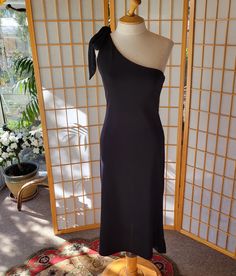 Lovely Polyester, Nylon and Spandex blend, with label, LORÉN French R.T.W. designer dress in black. Timeless off-the-shoulder fit excellent slip over dress for a cocktail party or evening out occasion.  Please refer to measurements below. ** Designer Label: LORÉN French R.T.W. Purchased at Saks Fifth Avenue in the 1990's.  ** Fabric: 82% Polyester 15% Nylon 3% Spandex Dry Clean Only ** Size: Labeled Large, please refer to measurements below for best modern fit. ** Measurements: laying flat from Designer Label, Spandex Dress, Black Cocktail, Designer Dress, Black Cocktail Dress, Dress Clothes For Women, Modern Fit, Cocktail Party, Saks Fifth