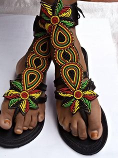 African beaded gladiator shoeVery beautiful and unique tooFully handmadeRasta sandals Bohemian T-strap Sandals With Round Toe, Black Beaded Bohemian Sandals, Black Bohemian Beaded Sandals, Bohemian T-strap Toe Post Sandals For Festivals, Bohemian T-strap Closed Toe Sandals For Festivals, Traditional Black Sandals For Festival, Bohemian Closed Toe T-strap Sandals For Festivals, Traditional Multicolor Ankle Strap Sandals, Traditional Ankle Strap Sandals For Festival