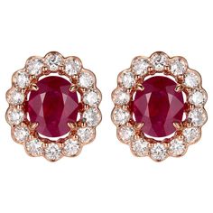 Introducing our Ruby Diamond Stud Earrings, exquisitely crafted in the romantic tones of 18K Rose Gold. These earrings feature the regal presence of rubies, totaling 1.36 carats, each stone radiating with a deep, crimson hue that captivates and enchants. The rubies are cut to perfection, showcasing their majestic color and splendid sparkle, making them the centerpiece of this elegant design. Surrounding the central gemstones is a halo of brilliant round-cut diamonds, weighing a total of 0.61 carats. These diamonds are chosen for their clarity and radiant shine, set to form a glistening frame that highlights the rubies' richness. The contrast between the vivid red of the rubies and the sparkling white of the diamonds creates a sophisticated and luxurious look that is timeless. The earrings Diamond Stud Earring, Rose Gold Earrings Studs, Rose Gold Studs, Diamond Stud Earrings, Matching Rings, Ruby Rose, Ruby Diamond, Diamond Stud, Modern Earrings