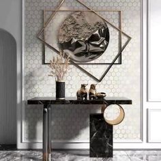 a black and white table with vases on it in front of a wall decoration