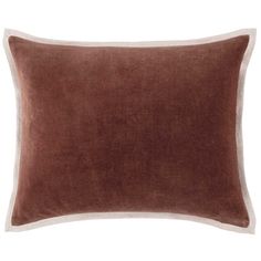 a brown and white pillow on a white background