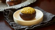 a muffin sitting on top of a white plate