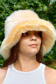 This light apricot fluffy faux fur hat is the perfect accessory to add a touch of glamour and fun to any outfit. Whether you're heading to a party or just want to brighten up your everyday look, this hat is a versatile and stylish choice. The rich apricot hue is beautifully complemented by the dark apricot undercoat, creating a stunning two-tone effect. Fluffy Hat, Fur Bucket, Fur Bucket Hat, Faux Fur Hat, Fur Hat, Hat Making, Everyday Look, Apricot, Bucket Hat